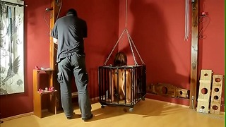 Barefoot Slave in Cage