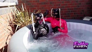 Lesbian Latex Lovers Play In The Hot Tub