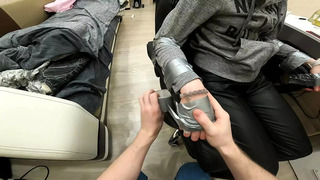Silver tape tied to chair, leather pants, sock gagged