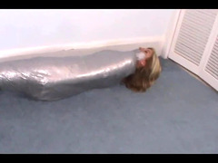 Girl wrapped in duct tape like a mummy