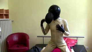 Latex Queen Chokes on Rubber Ball Hood & Dildo