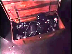 Bondage Latex girl locked in box